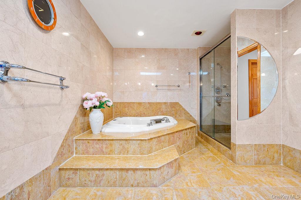 64-16 211th Street Queens, NY 11364 - Photo 17 of 22 a bathroom with a sink and a mirror