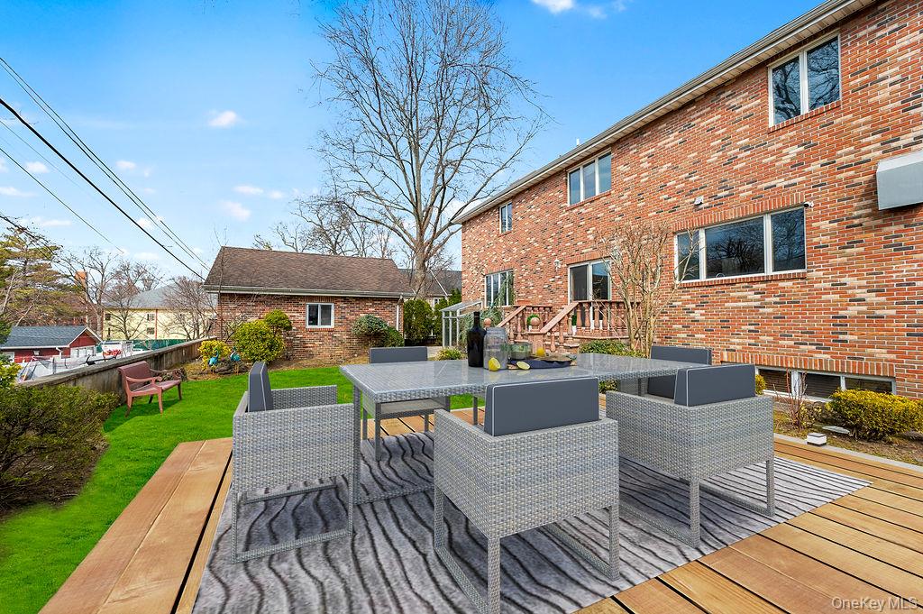 64-16 211th Street Queens, NY 11364 - Photo 19 of 22 a view of house with patio outdoor seating