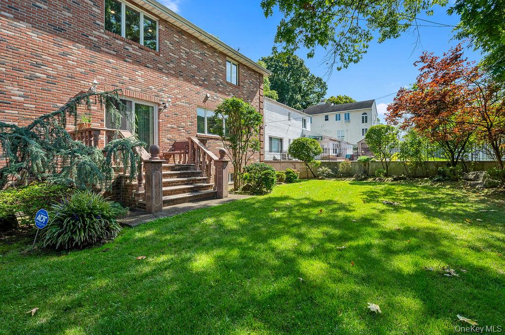 64-16 211th Street Queens, NY 11364 - Photo 20 of 22 a view of a house with a yard