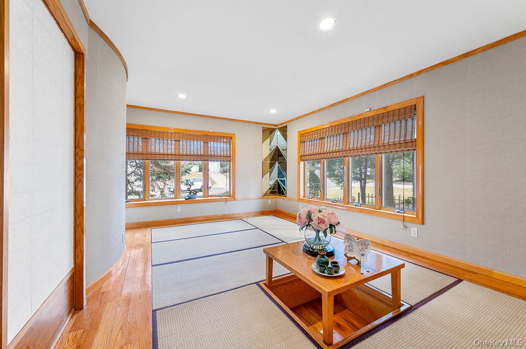 64-16 211th Street Queens, NY 11364 - Photo 9 of 22 a living room with furniture and a large window