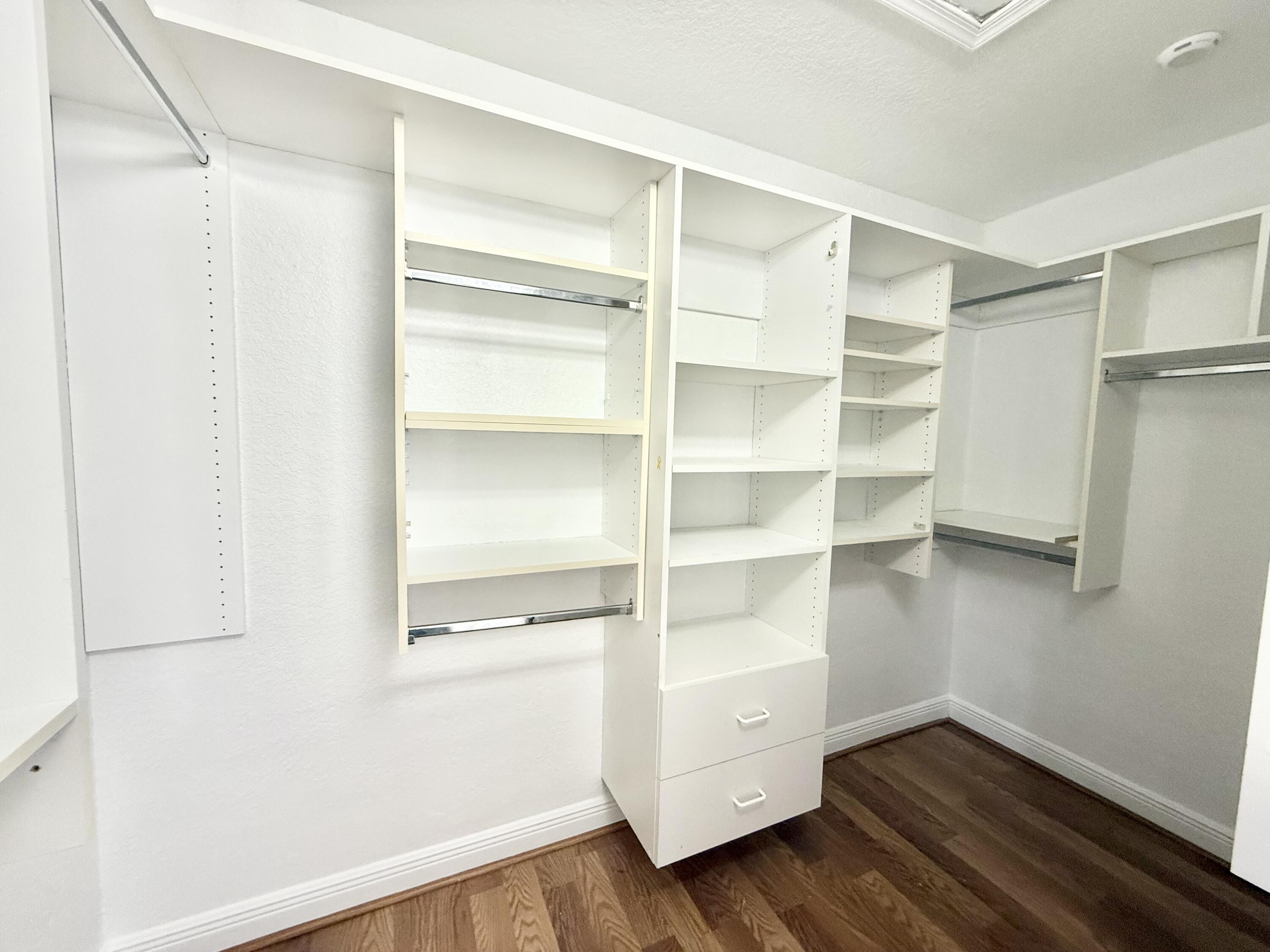 11553 Big Sky Court Boca Raton, FL 33498 - Photo 11 of 43 a view of walk in closet with empty racks