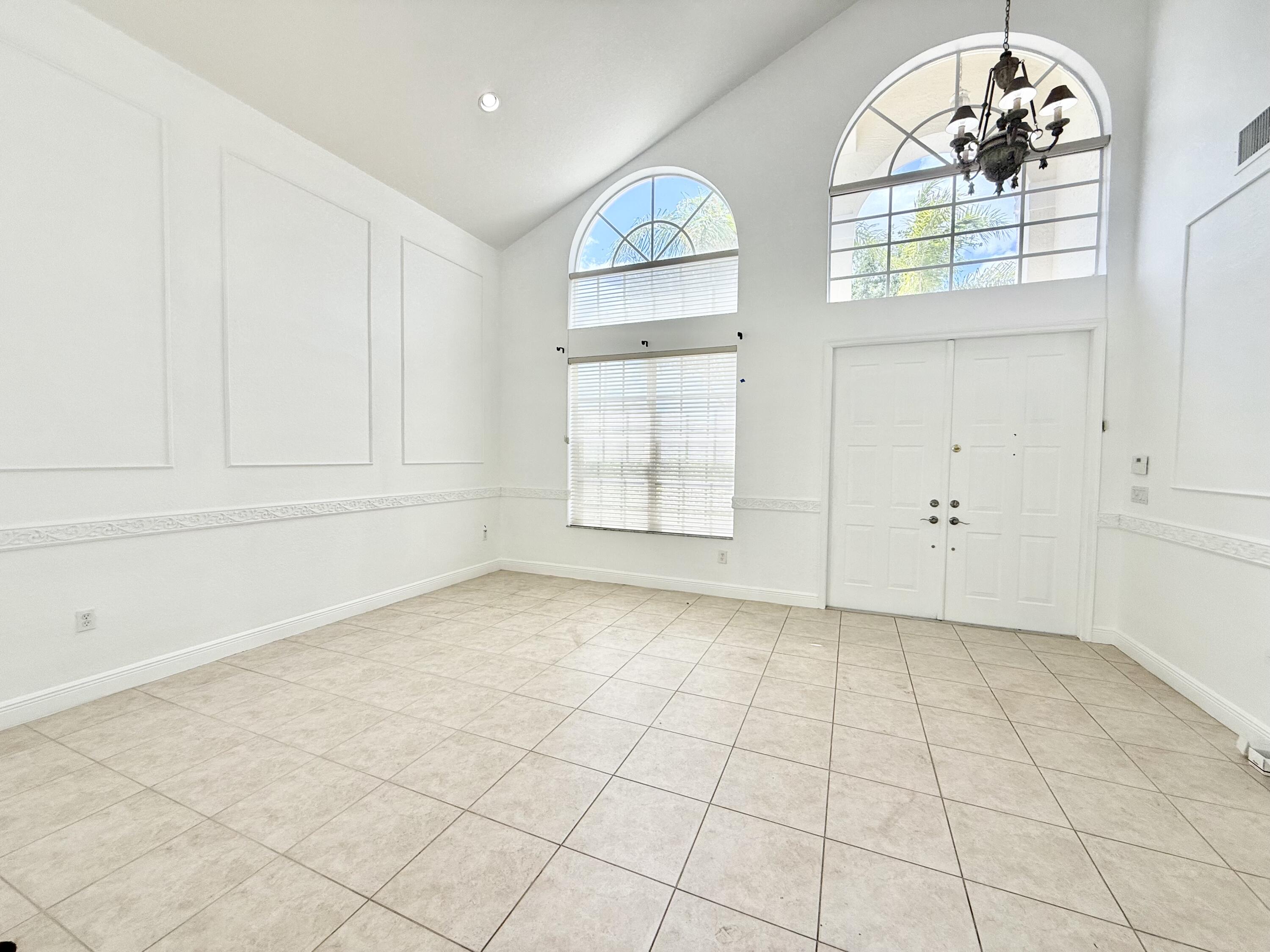 11553 Big Sky Court Boca Raton, FL 33498 - Photo 17 of 43 an empty room with windows