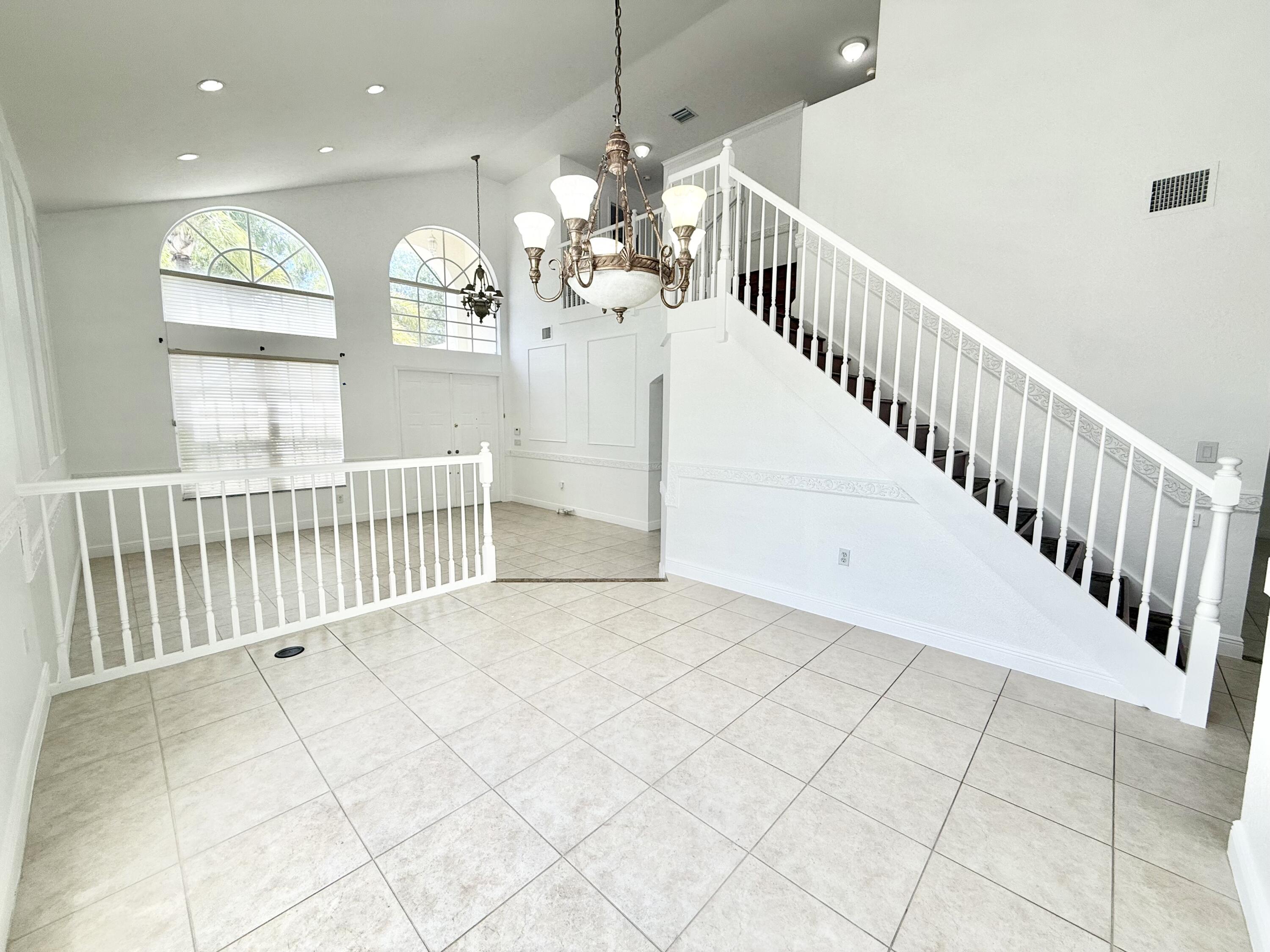 11553 Big Sky Court Boca Raton, FL 33498 - Photo 18 of 43 a view of entryway and hall with wooden floor