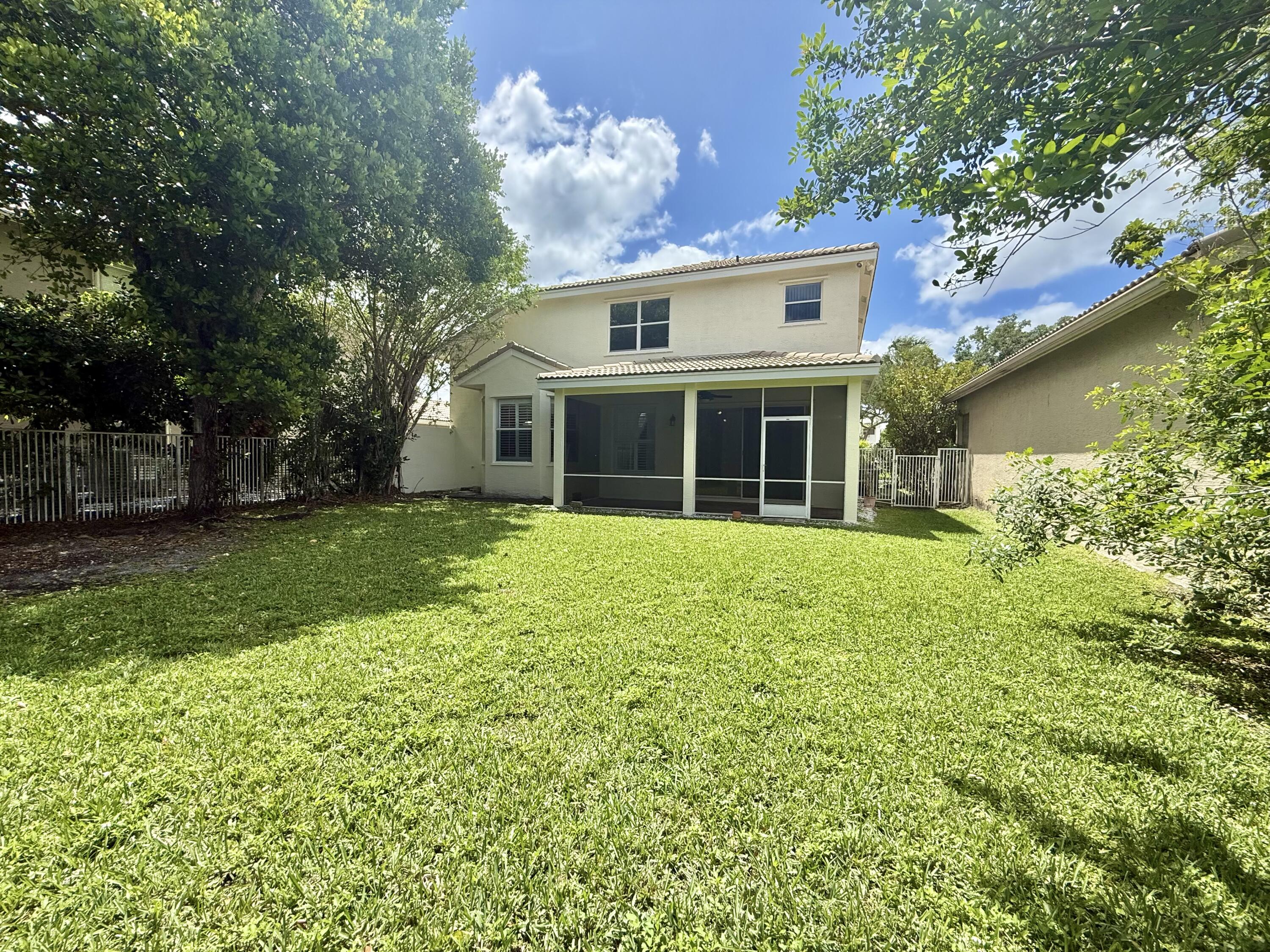 11553 Big Sky Court Boca Raton, FL 33498 - Photo 28 of 43 a front view of house with yard and green space