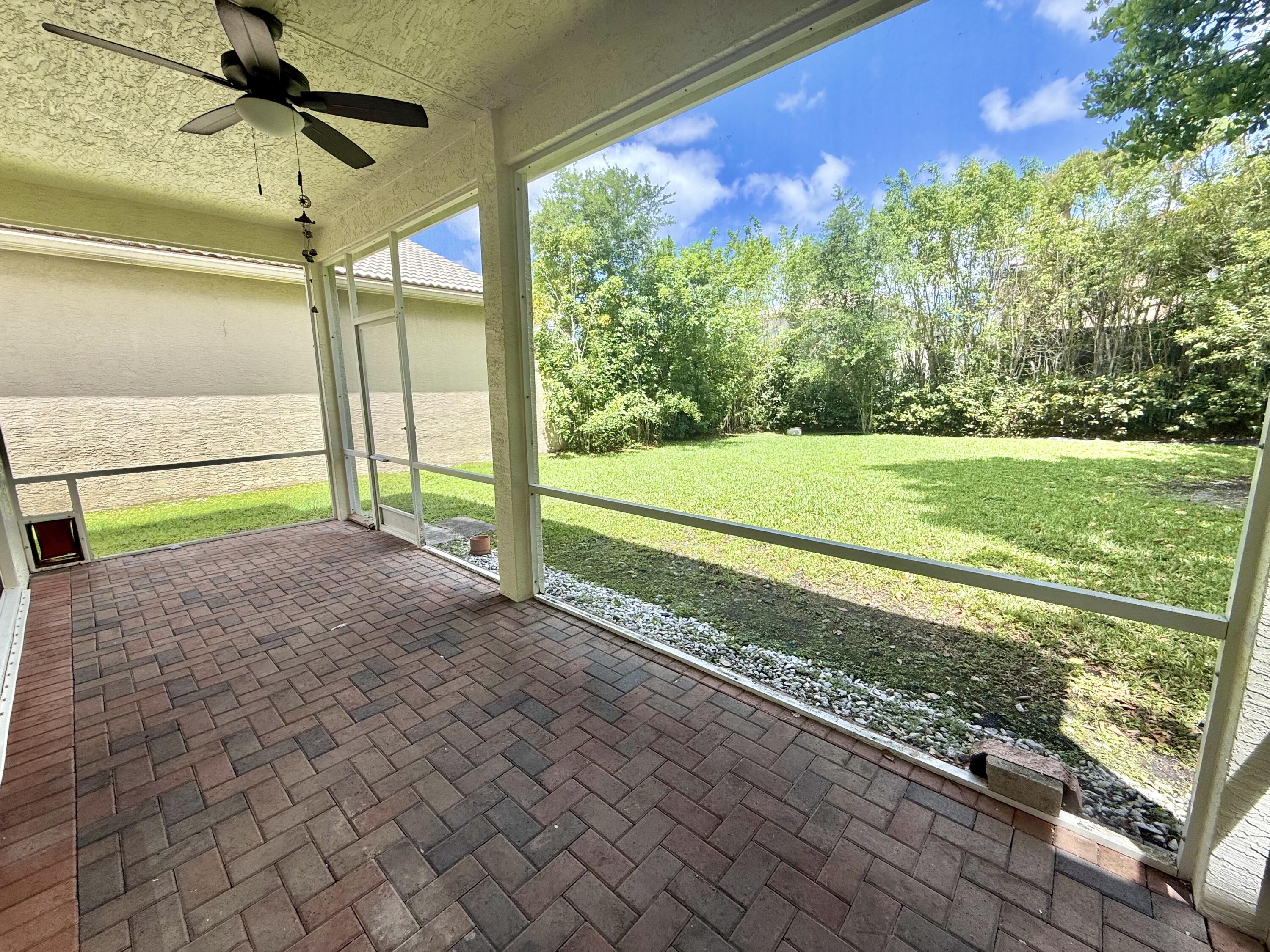 11553 Big Sky Court Boca Raton, FL 33498 - Photo 29 of 43 a view of a yard with an outdoor space