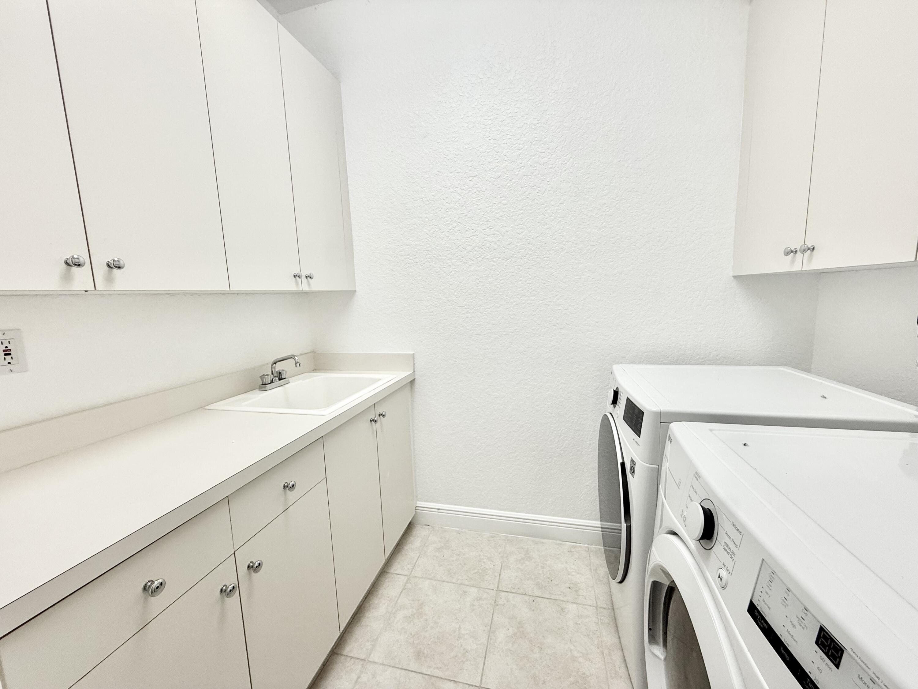 11553 Big Sky Court Boca Raton, FL 33498 - Photo 30 of 43 a utility room with dryer and washer