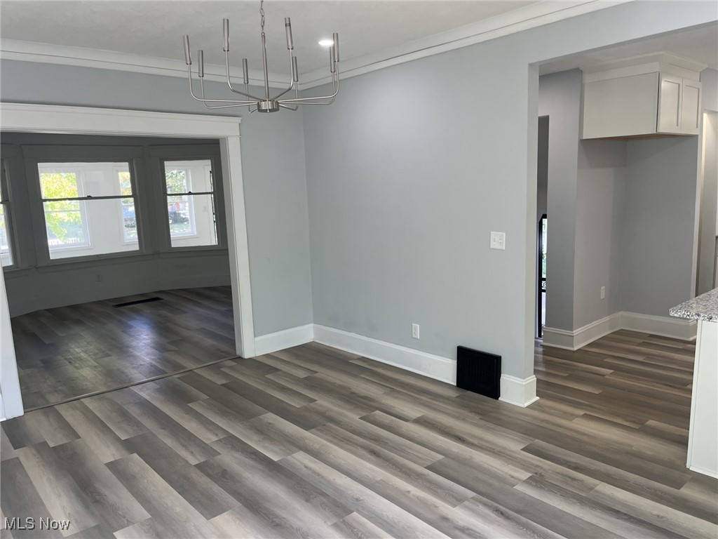 3264 Altamont Road Cleveland, OH 44118 - Photo 9 of 32 Unfurnished dining area that opens up into kitchen features a chandelier, and recessed lighting