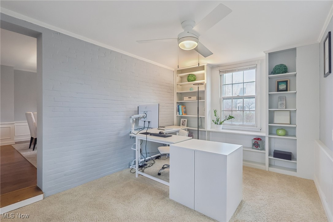 17024 Fernway Road Cleveland, OH 44120 - Photo 18 of 46 Home office with ornamental molding, a ceiling fan, light colored carpet, brick wall, and built in features