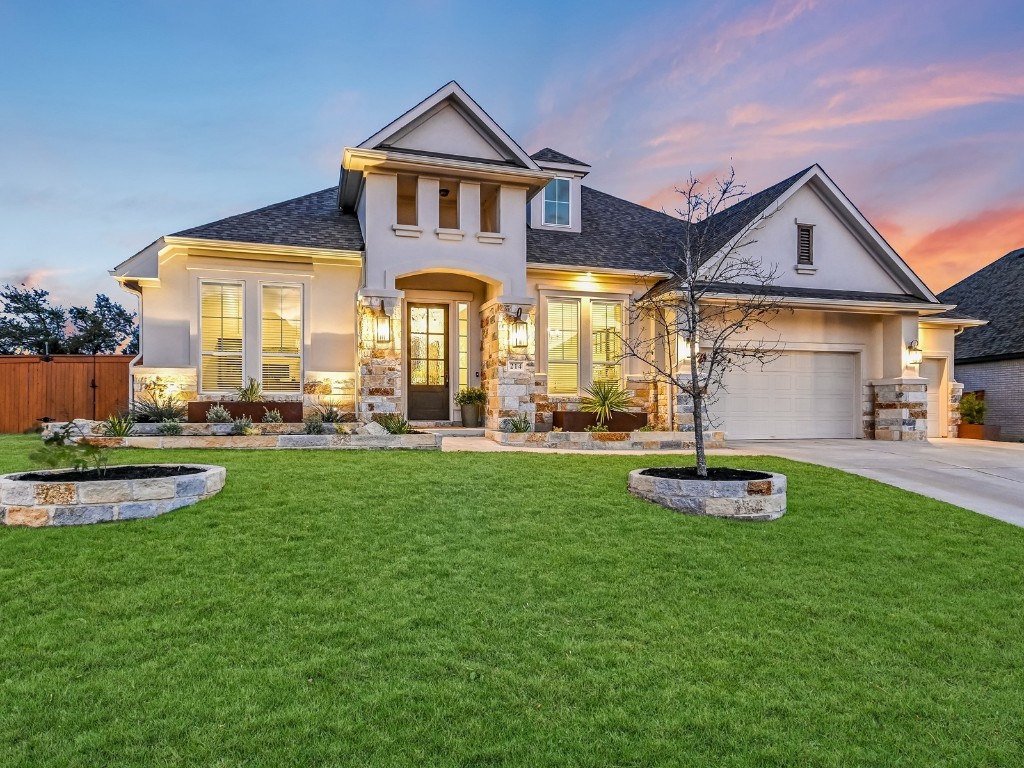 a front view of a house with a yard