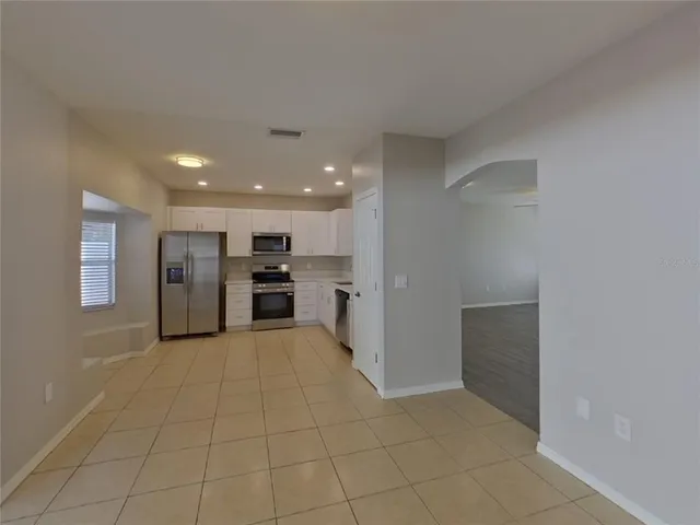 a view of a kitchen with a sink