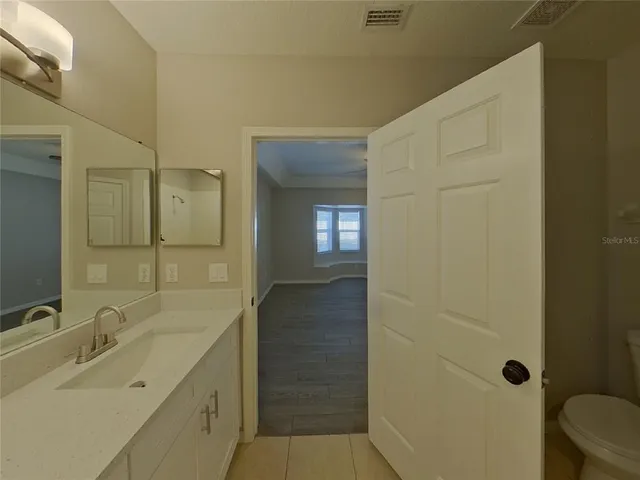 a bathroom with a sink and mirror
