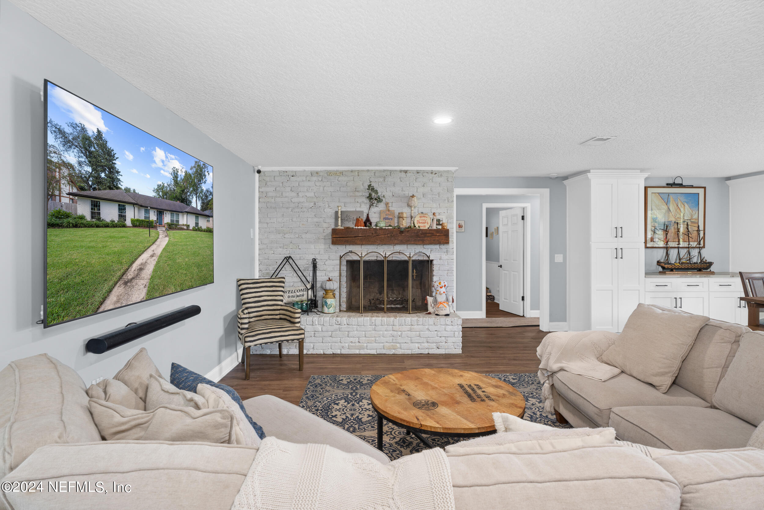 9448 Wexford Road Jacksonville, FL 32257 - Photo 12 of 27 a living room with furniture and a fireplace