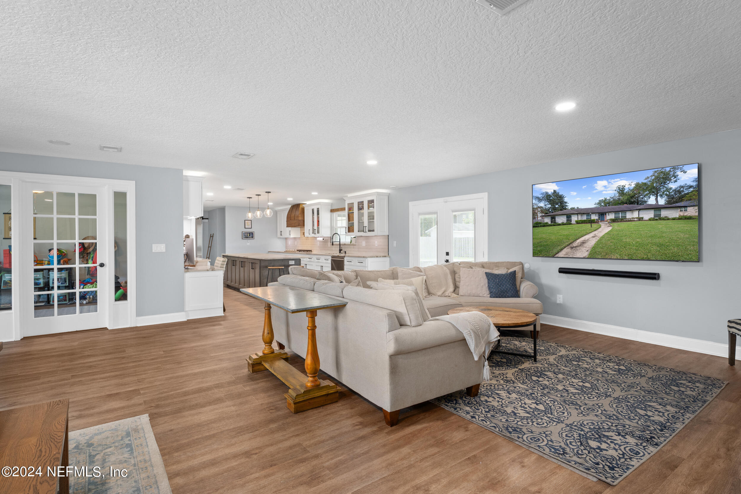 9448 Wexford Road Jacksonville, FL 32257 - Photo 13 of 27 a living room with furniture and a flat screen tv