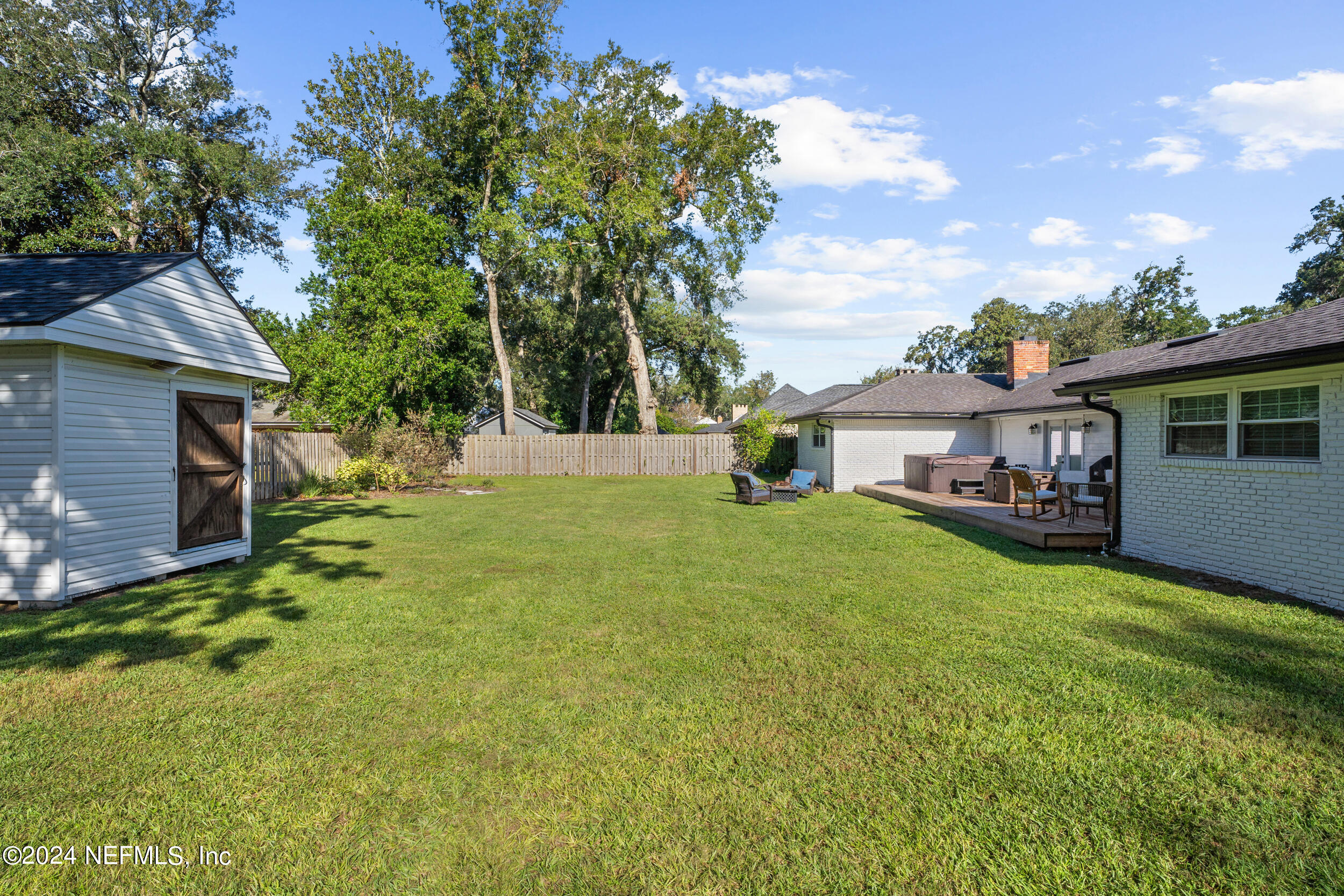 9448 Wexford Road Jacksonville, FL 32257 - Photo 24 of 27 a front view of house with yard and green space