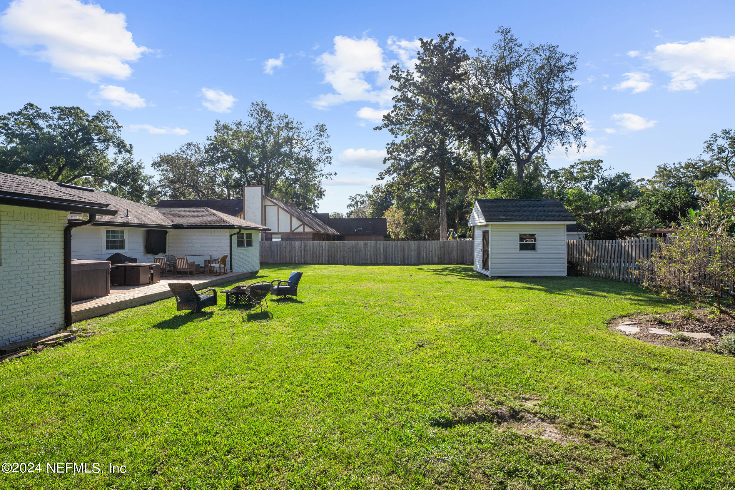 9448 Wexford Road Jacksonville, FL 32257 - Photo 27 of 27 a view of a house with backyard and a tree