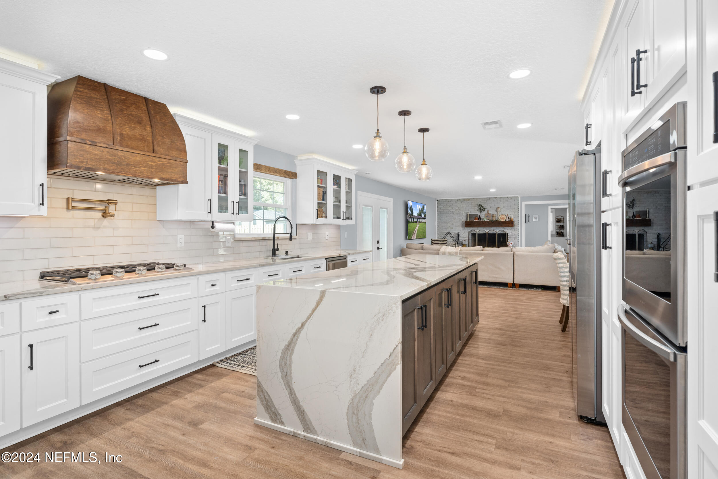 9448 Wexford Road Jacksonville, FL 32257 - Photo 6 of 27 a large kitchen with stainless steel appliances kitchen island granite countertop a large counter top and stainless steel appliances