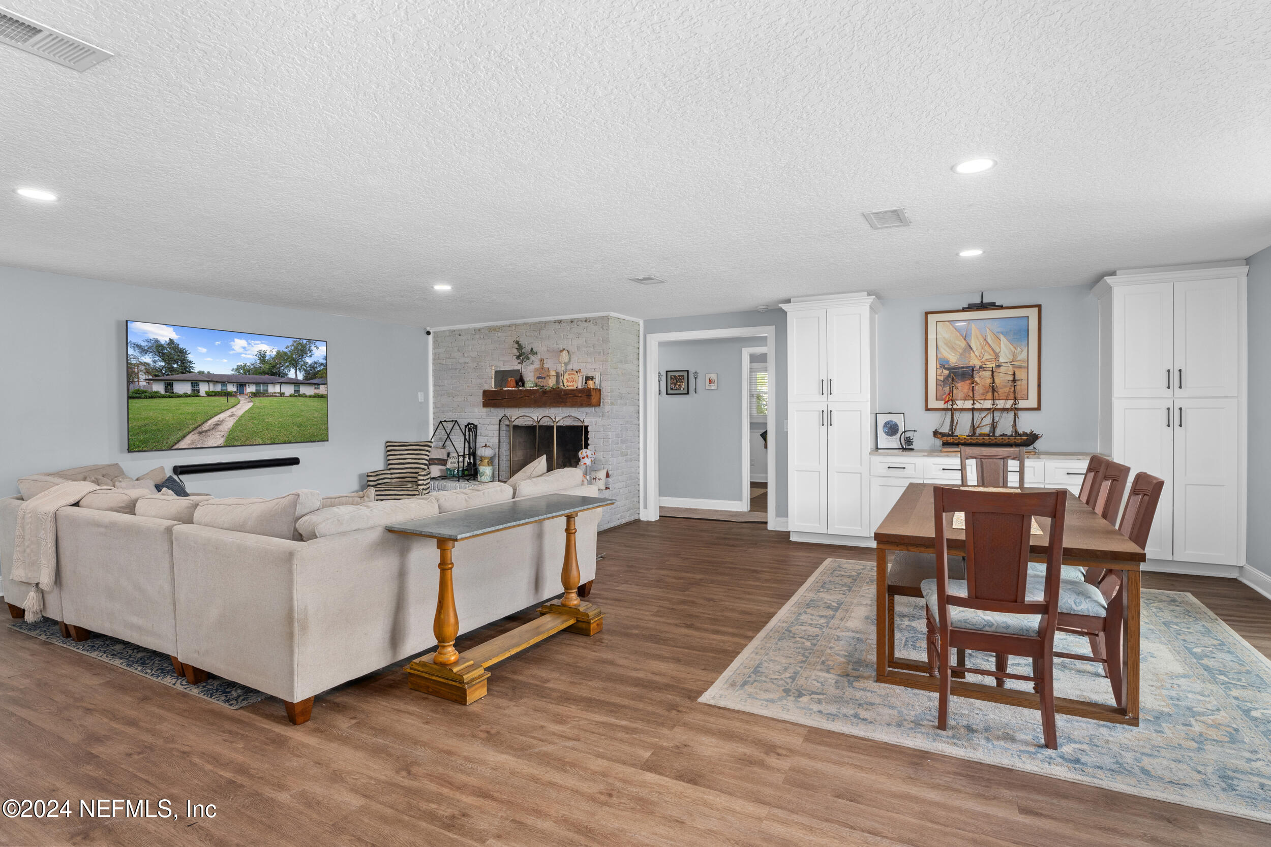 9448 Wexford Road Jacksonville, FL 32257 - Photo 8 of 27 a living room with furniture and a flat screen tv