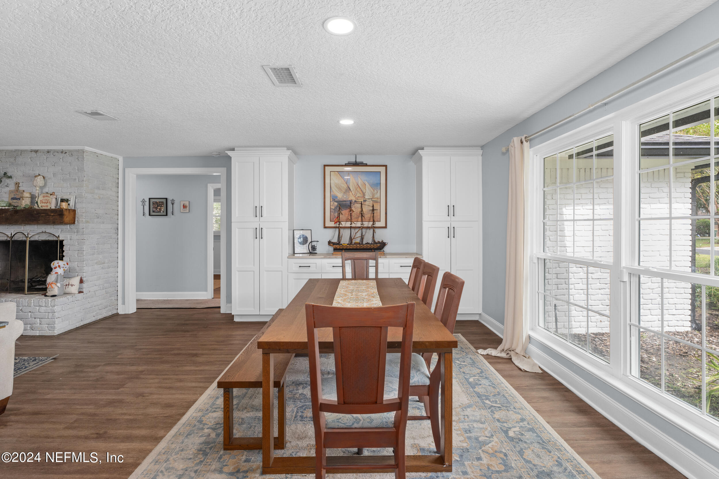9448 Wexford Road Jacksonville, FL 32257 - Photo 9 of 27 a view of a dining room with furniture window and wooden floor