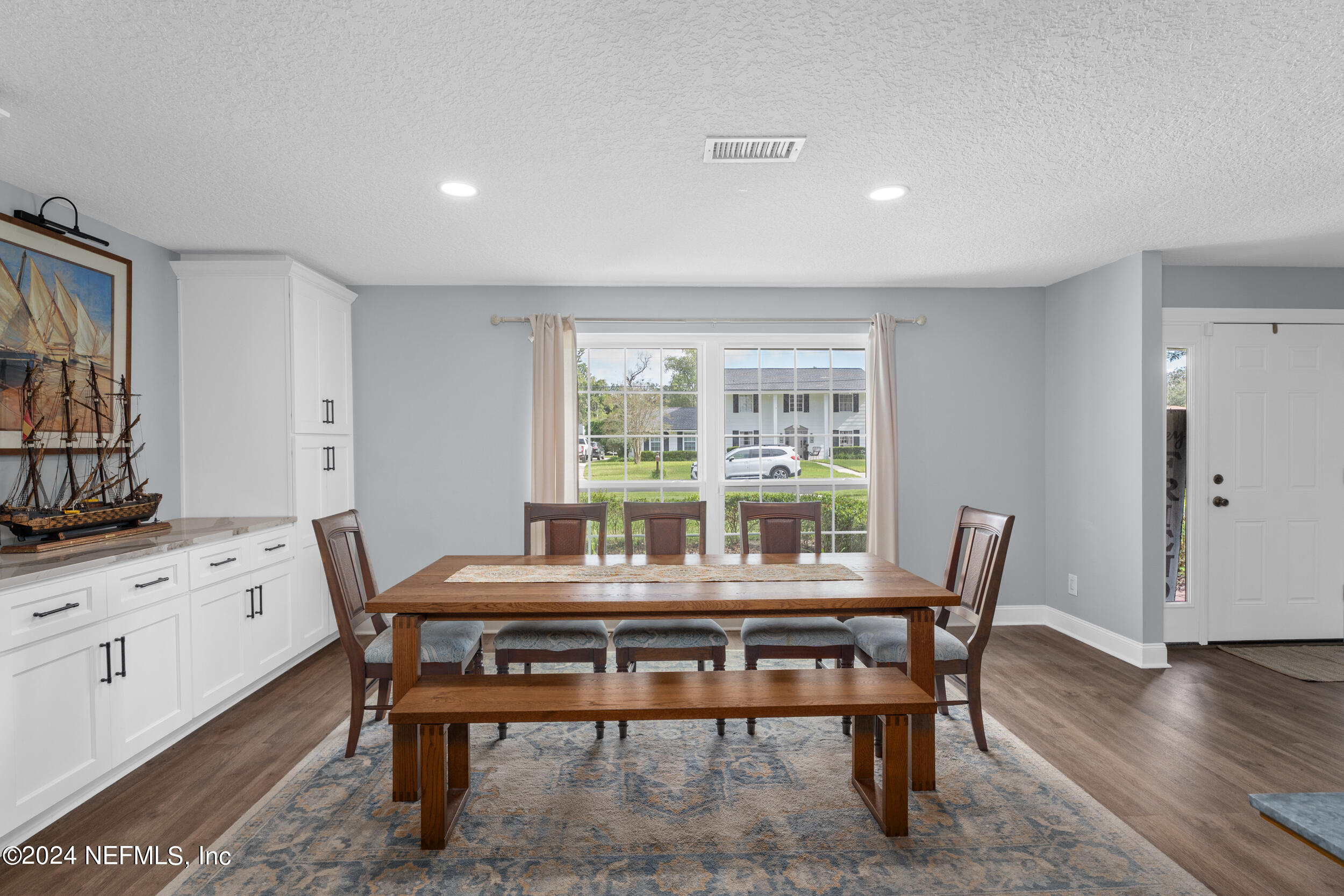 9448 Wexford Road Jacksonville, FL 32257 - Photo 10 of 27 a dining room with furniture and wooden floor