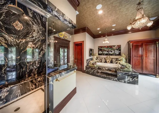 a bedroom with a large bed and a large window