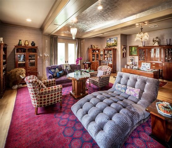 a living room with lots of furniture and a rug