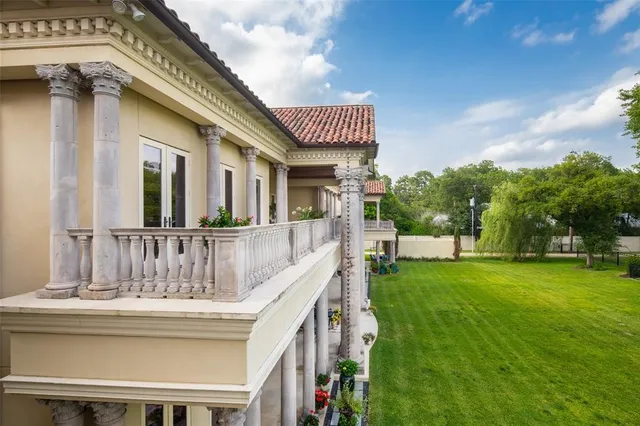 a view of a house with swimming pool and garden