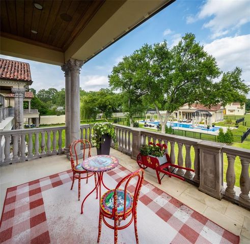 a view of a chairs and table in patio