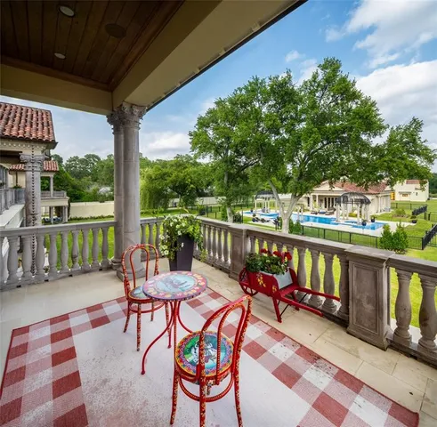 a view of a chairs and table in patio