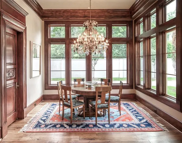 a view of a dining room with furniture wooden floor and a rug