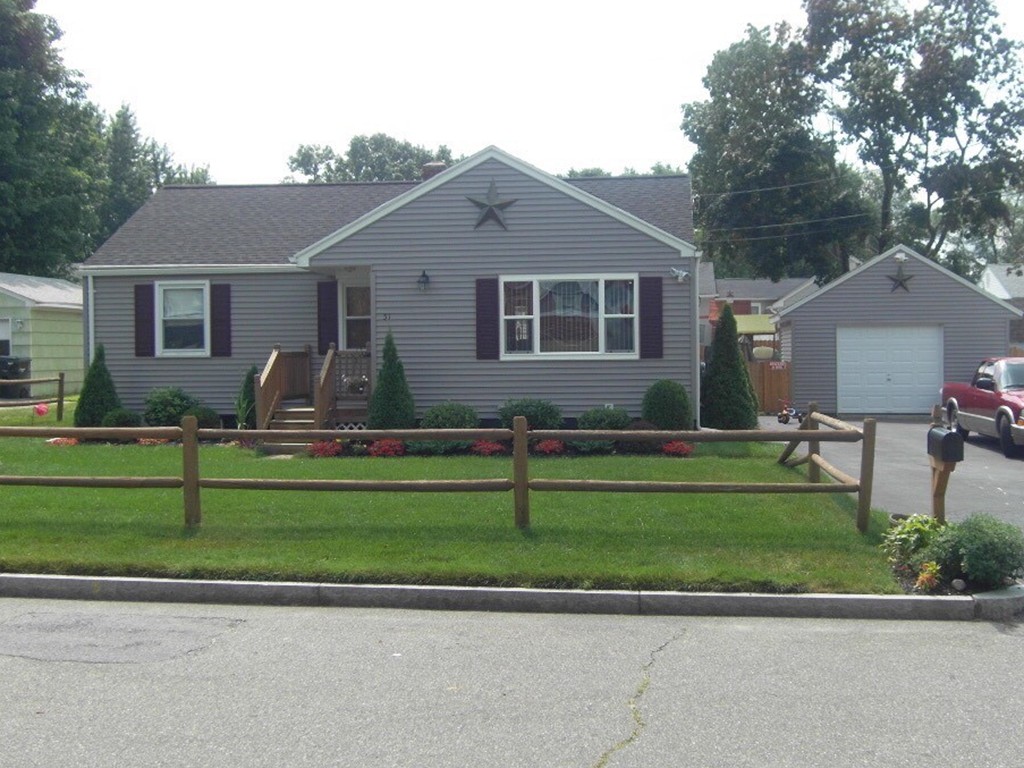 51 Cheyenne Road Springfield, MA 01109 - Photo 1 of 28 a front view of a house with a yard