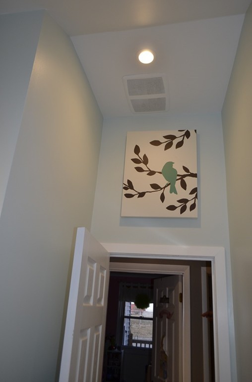 51 Cheyenne Road Springfield, MA 01109 - Photo 12 of 28 a view of a hallway with a fireplace
