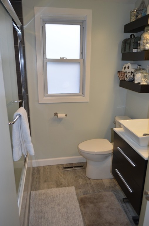 51 Cheyenne Road Springfield, MA 01109 - Photo 14 of 28 a bathroom with a toilet a sink and a mirror