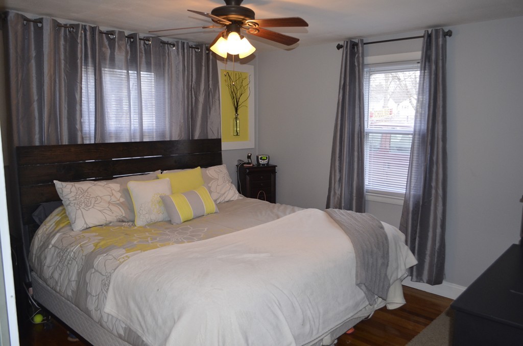 51 Cheyenne Road Springfield, MA 01109 - Photo 16 of 28 a bed sitting in a bedroom next to a window