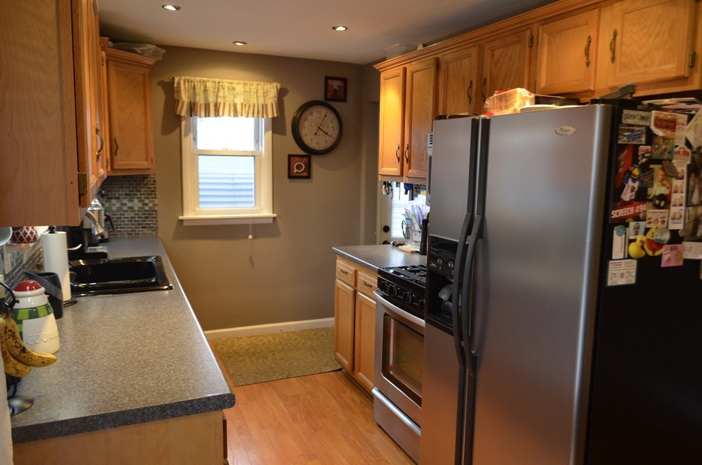 51 Cheyenne Road Springfield, MA 01109 - Photo 2 of 28 a kitchen with stainless steel appliances granite countertop a refrigerator a stove and a sink