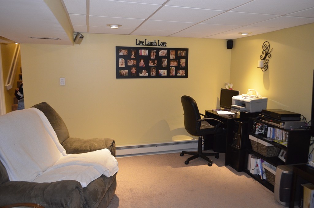 51 Cheyenne Road Springfield, MA 01109 - Photo 22 of 28 a view of a workspace with furniture and a air conditioner vent
