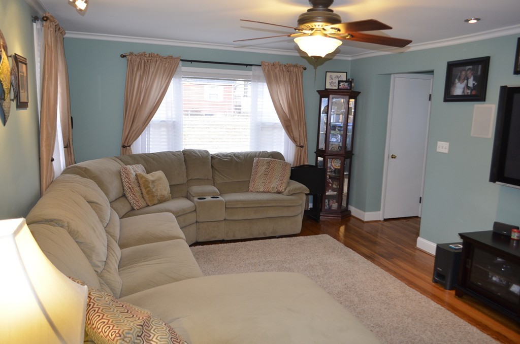 51 Cheyenne Road Springfield, MA 01109 - Photo 5 of 28 a living room with furniture and a large window
