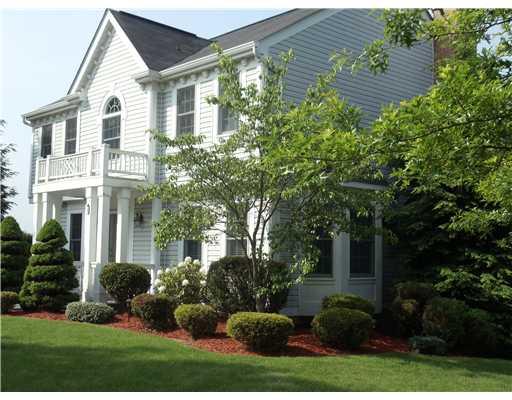 Exterior Front. Stately Colonial with perfectly manicured lawn.