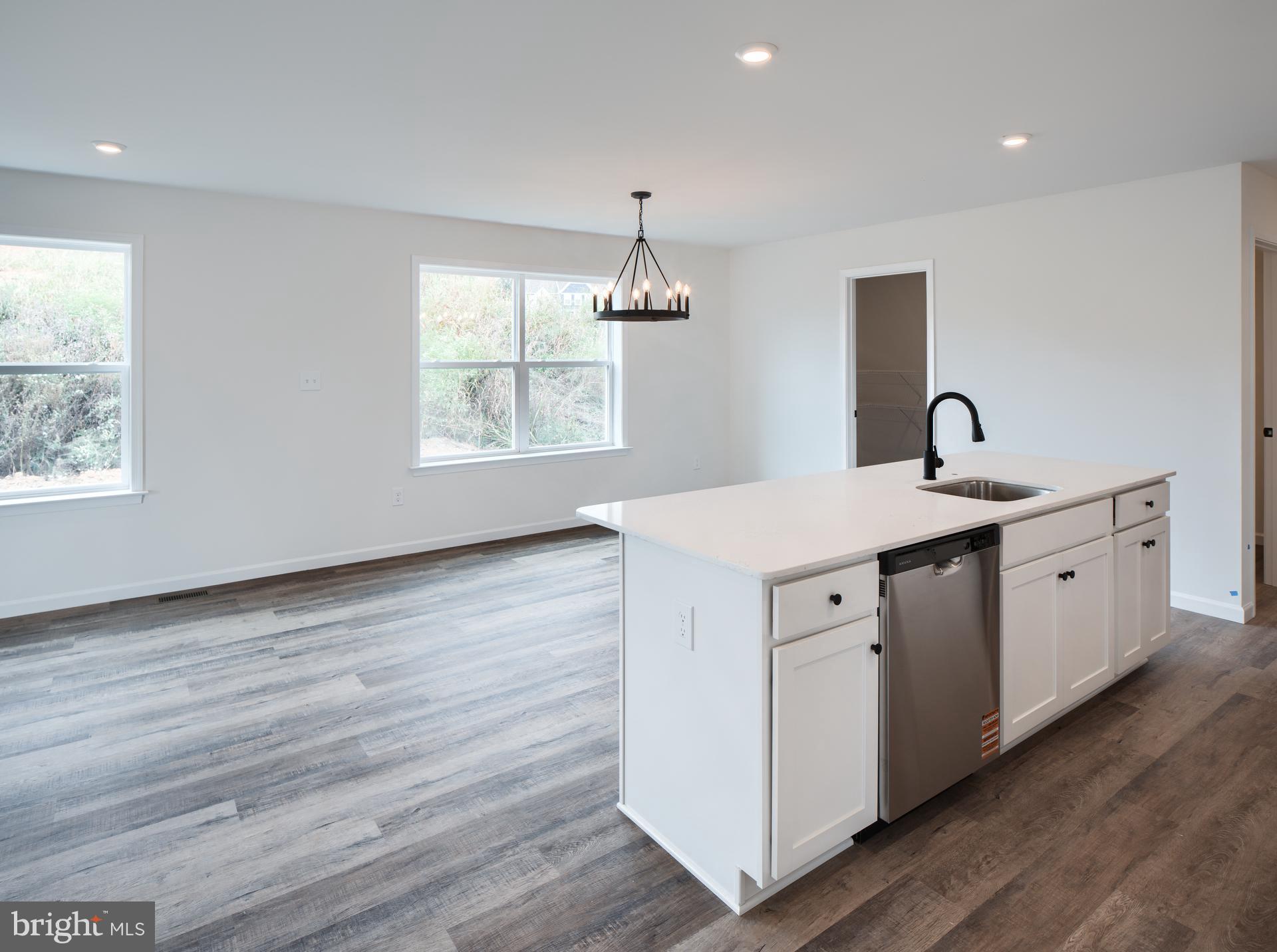 311 Boxwood Drive Windsor, PA 17366 - Photo 12 of 50 a kitchen with a sink cabinets and wooden floor