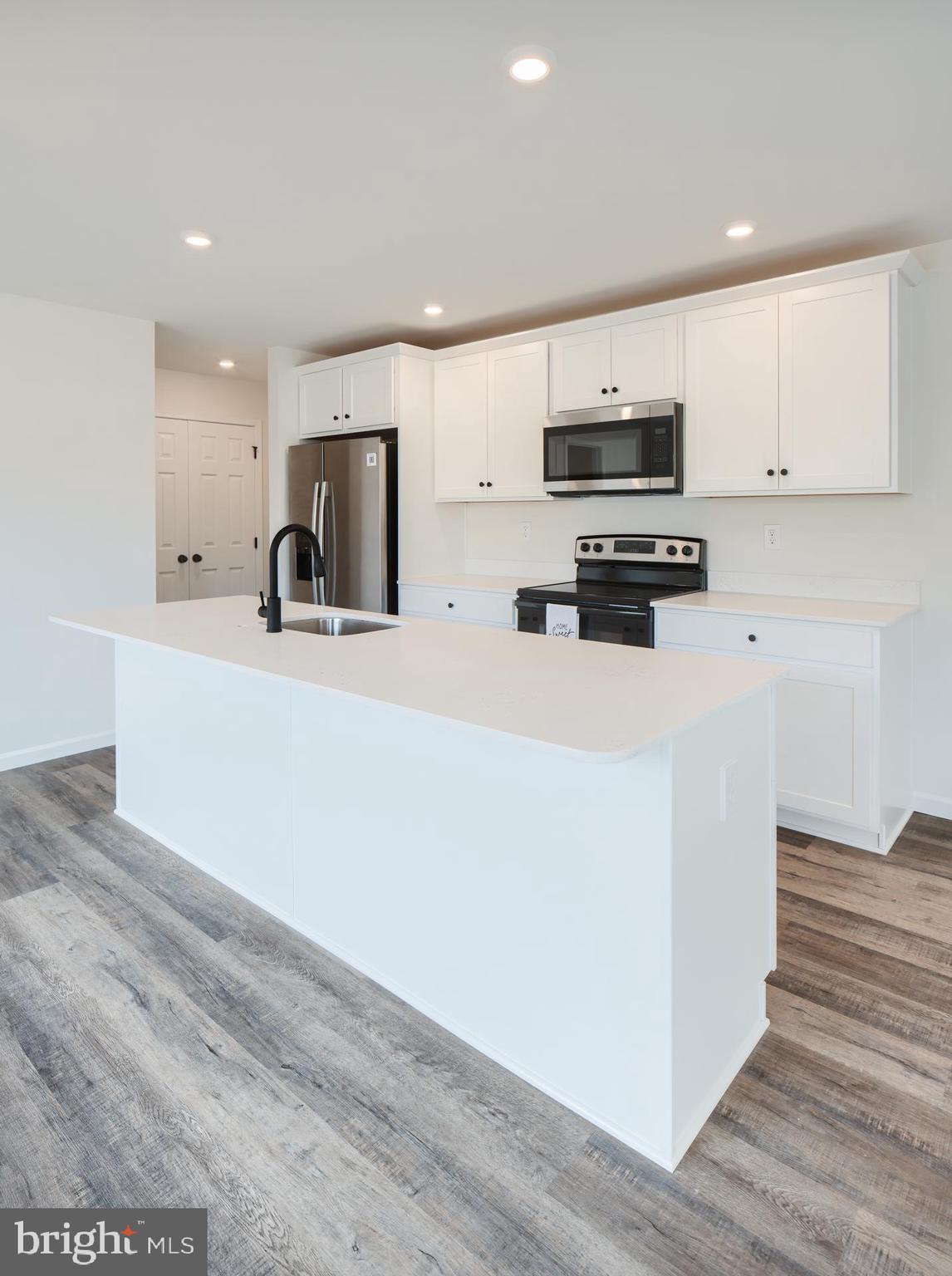 311 Boxwood Drive Windsor, PA 17366 - Photo 19 of 50 a kitchen with stainless steel appliances a refrigerator sink and microwave