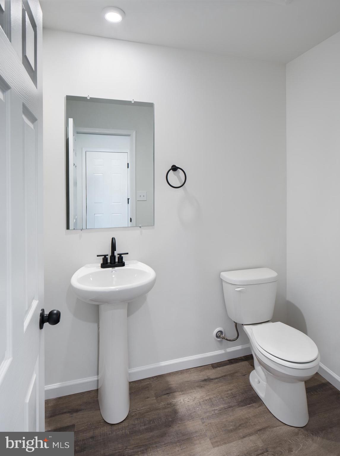 311 Boxwood Drive Windsor, PA 17366 - Photo 25 of 50 a bathroom with a toilet sink and mirror