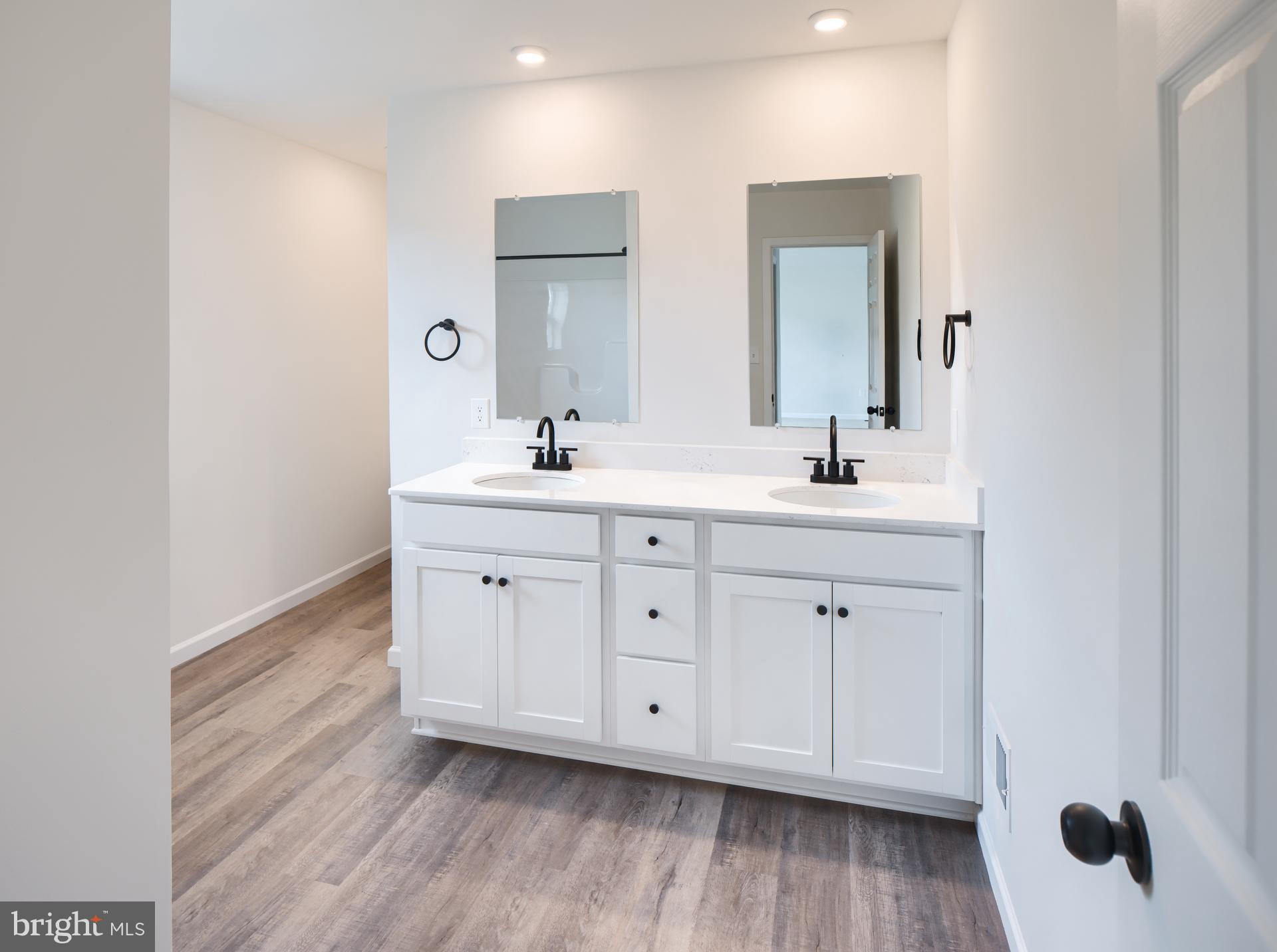 311 Boxwood Drive Windsor, PA 17366 - Photo 6 of 50 a spacious bathroom with double vanity sink a mirror and window