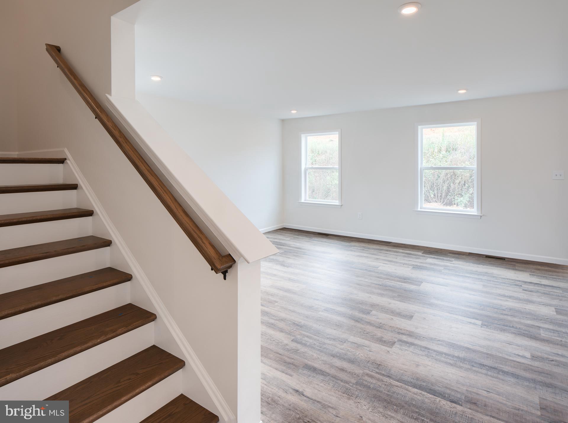 311 Boxwood Drive Windsor, PA 17366 - Photo 10 of 50 a view of entryway with wooden floor and stairs