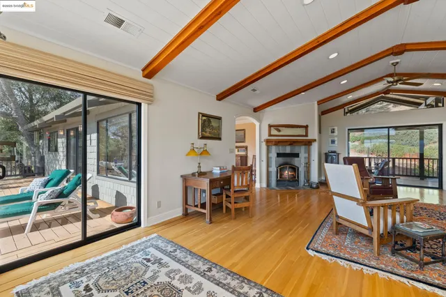 a kitchen with stainless steel appliances granite countertop a sink a refrigerator and a stove