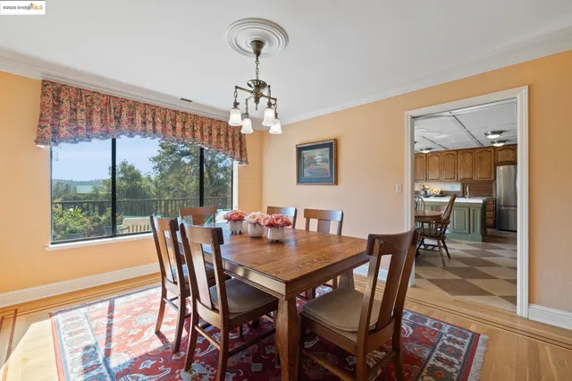 a bedroom with furniture a bed and a large window