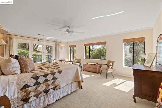 a view of walk in closet with clothes