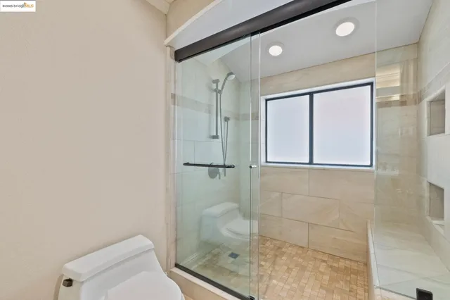 a view of hallway with wooden floor