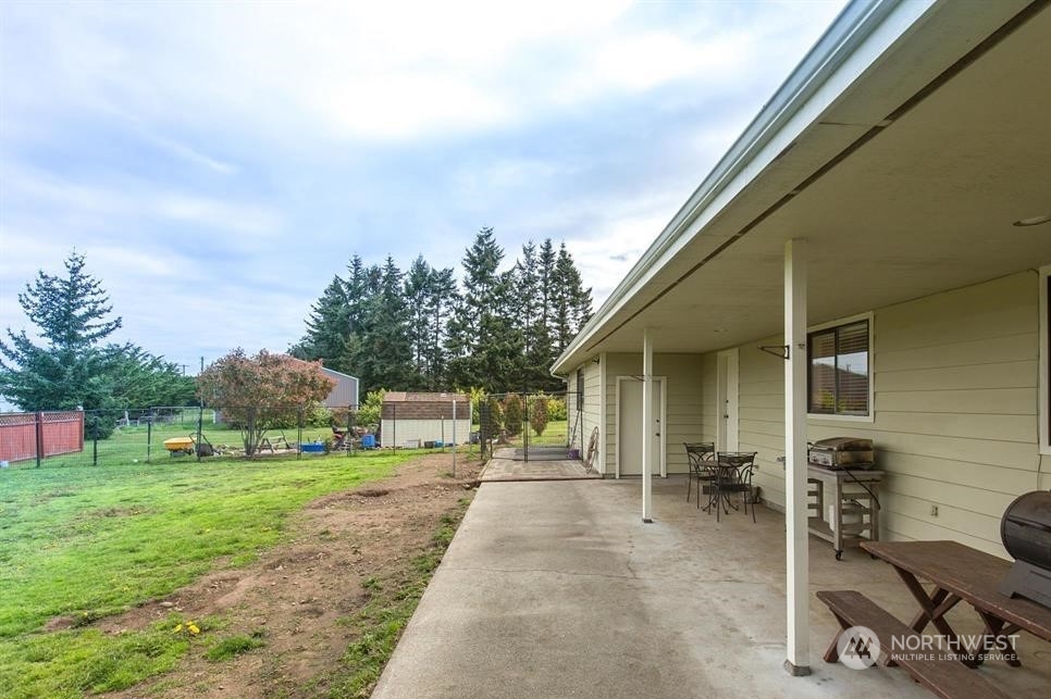 819 North Kendall Road Sequim, WA 98382 - Photo 15 of 40 a view of a backyard with sitting area