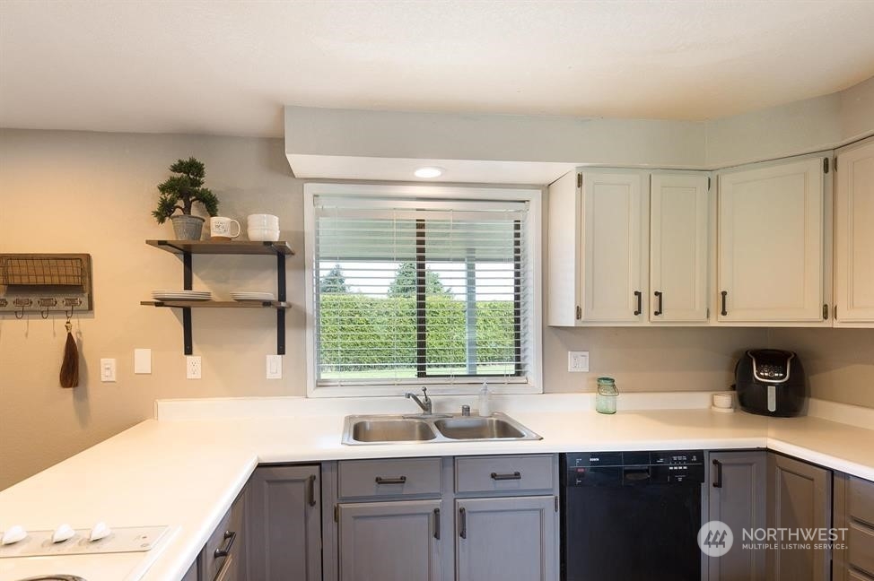 819 North Kendall Road Sequim, WA 98382 - Photo 30 of 40 a kitchen with a sink and cabinets