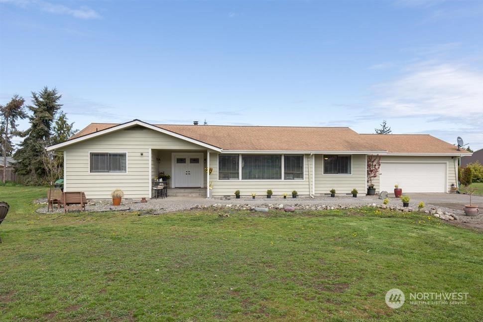 819 North Kendall Road Sequim, WA 98382 - Photo 4 of 40 a front view of house with yard and seating area