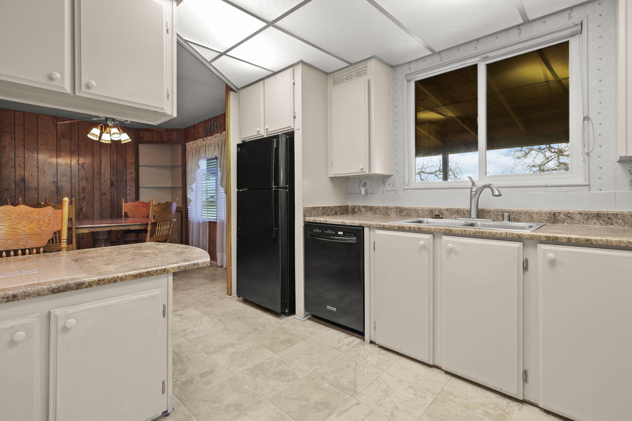 836 August Way Redding, CA 96003 - Photo 12 of 32 a kitchen with a sink stove and refrigerator